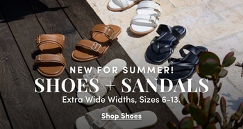 Promotional banner for 'New For Summer! Shoes + Sandals' featuring three pairs of sandals arranged on a wooden deck surface with natural foliage in the corner: tan double-strap buckle slides, white slides, and black thong flip-flops. Text overlays read 'New For Summer!', 'Shoes + Sandals', 'Extra Wide Widths, Sizes 6-13.', and 'Shop Shoes'.