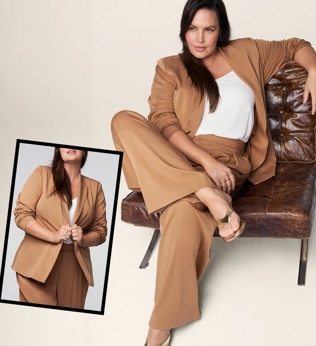 A vertical banner with a warm cream background showing the same woman with long dark hair seated on a tufted dark brown leather chair in the main image, wearing a camel tan open-front blazer over a white camisole and matching wide-leg trousers, with a gold thong sandal on one crossed foot. She wears small hoop earrings and a ring. An inset photo with a black border in the lower left shows a cropped torso close-up of the same outfit against a gray background, with the woman holding the blazer lapels.