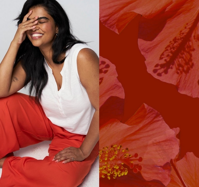 A two-panel image.A two-panel image. On the left, a woman with long dark hair sits on the floor with her knees bent, laughing with her eyes closed and one hand raised to cover her face. She has a small tattoo on her upper arm, wears small stud earrings and a ring, and is dressed in a white sleeveless V-neck top with a button placket and wide-leg red-orange pants. Her nails are painted light pink. The background is a plain light gray. On the right, a close-up macro photo of hibiscus flowers with pink and coral petals, yellow stamens, and a deep red background.