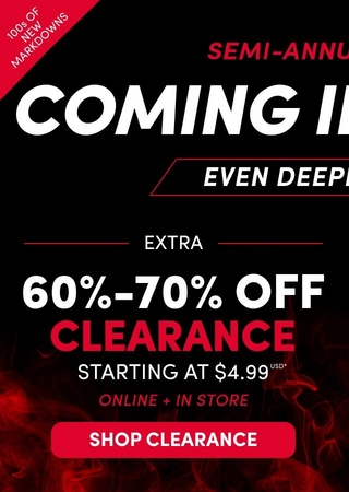 A mobile promotional banner with a dark background and red flame and smoke graphic. Partially visible text at the top reads 'UAL Sale' in red script and 'N HOTTER' in large white and orange bold text with a flame graphic, and 'ER DEALS!' in white. A white circle badge reads 'ONLINE + IN STORE EARN 3X TORRID CASH**' White text reads 'EXTRA' followed by large white text reading '60%-70%' and large red text reading 'CLEARANCE' with white text below reading 'STARTING AT $4.99 USD*' A white-outlined rectangular badge reads '100s OF NEW MARKDOWNS' and a red rounded rectangular button reads 'SHOP CLEARANCE' in white text.