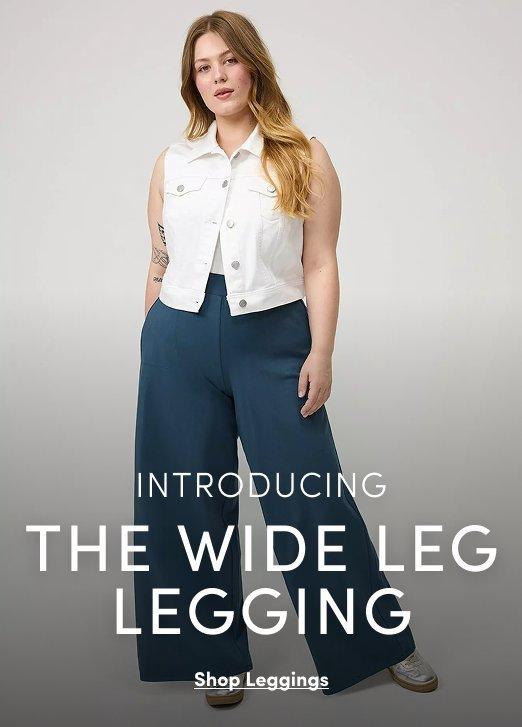 A promotional banner with a light gray background. A woman with long blonde hair stands with one hand on her hip, wearing a white sleeveless denim button-front vest top and wide-leg teal pants, with gray sneakers. White text overlay reads 'INTRODUCING THE WIDE LEG LEGGING' with an underlined link reading 'Shop Leggings.'