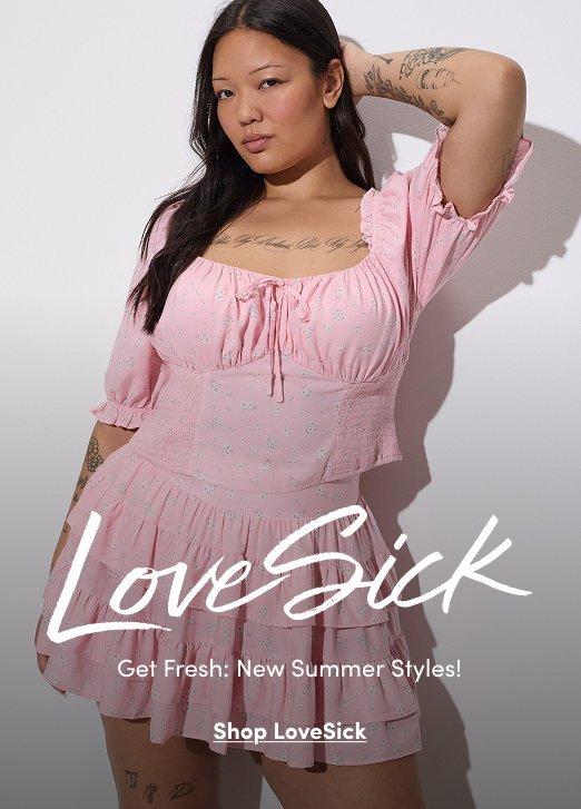 A model wears a light pink tiered mini dress with puff sleeves and a tie-front neckline. Text reads, “LoveSick. Get Fresh: New Summer Styles! Shop LoveSick.”