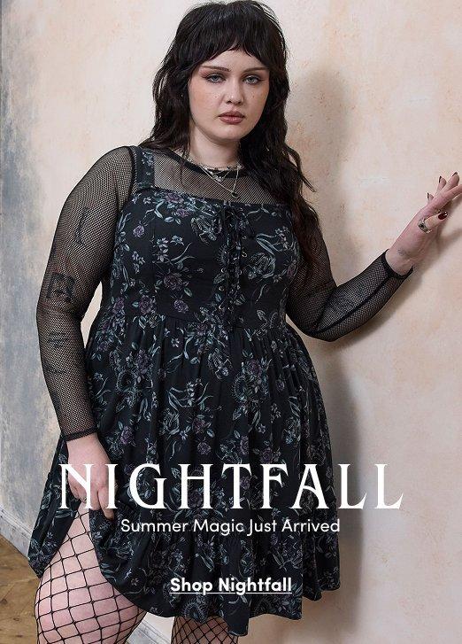 A model wears a black floral dress layered over a sheer black mesh top with fishnet tights. Text reads, “Nightfall. Summer Magic Just Arrived. Shop Nightfall.”