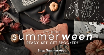 Promotional banner for the 'Summerween' collection featuring a dark moody flat-lay styling of various tops and apparel with autumn-meets-Halloween theme. Black tops with embellishments including rhinestone detailing and embroidered graphics are displayed alongside scattered burgundy and orange autumn leaves and a small pumpkin. Halloween-themed graphics and skeleton designs appear on some items. Text overlays read 'It's Here!', 'summerween', 'Ready. Set. Get Spooked!', and 'Shop Summerween'.