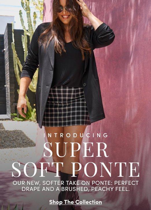 Model wearing a black Super Soft Ponte blazer over a black top with a black-and-white plaid mini skirt, styled with knee-high boots and sunglasses outdoors. Text reads, “Introducing Super Soft Ponte. Our new, softer take on ponte: perfect drape and a brushed, peachy feel.” with a “Shop The Collection” call to action.