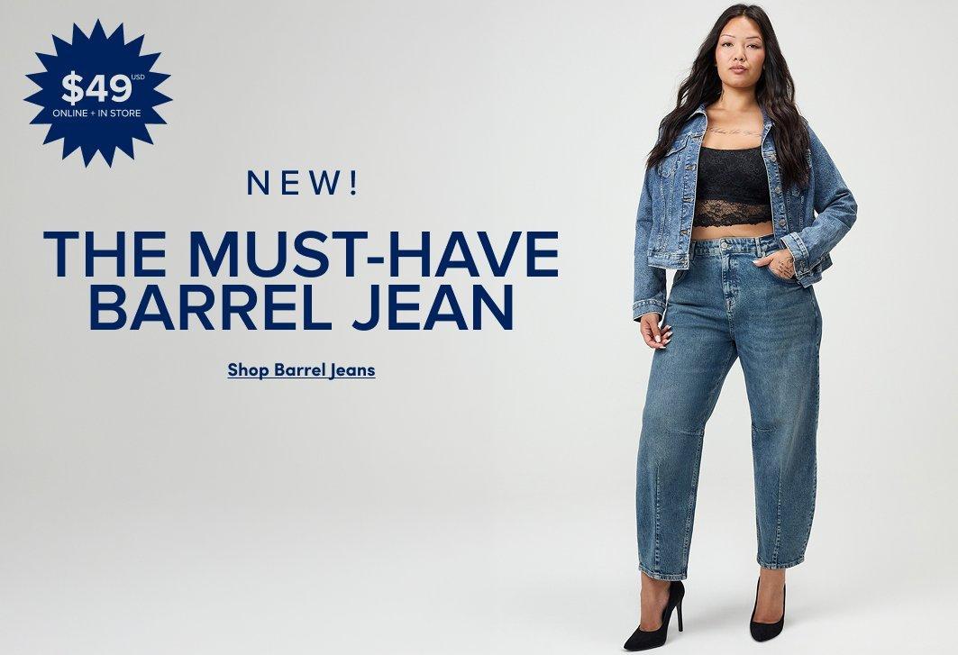 Banner ad for the Barrel Jean. A woman with long dark hair stands against a light gray background, wearing a black lace bralette, a denim jacket, medium wash barrel-leg jeans, and black heels. Text reads: $49 USD Online and In Store, New! The Must-Have Barrel Jean, Shop Barrel Jeans."