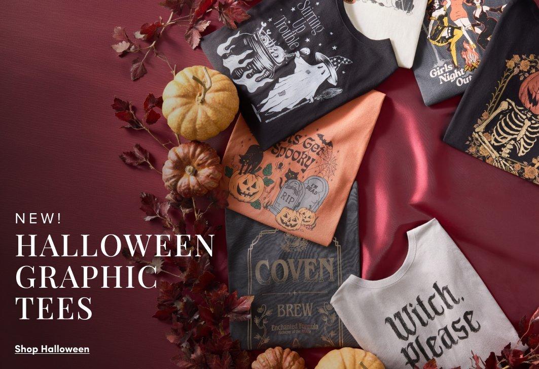 Flat lay of Halloween graphic tees featuring spooky illustrations, pumpkins, ghosts, skeletons, witches, and Halloween-themed text, surrounded by pumpkins and fall leaves. Text reads, “New! Halloween Graphic Tees,” with a “Shop Halloween” call to action.