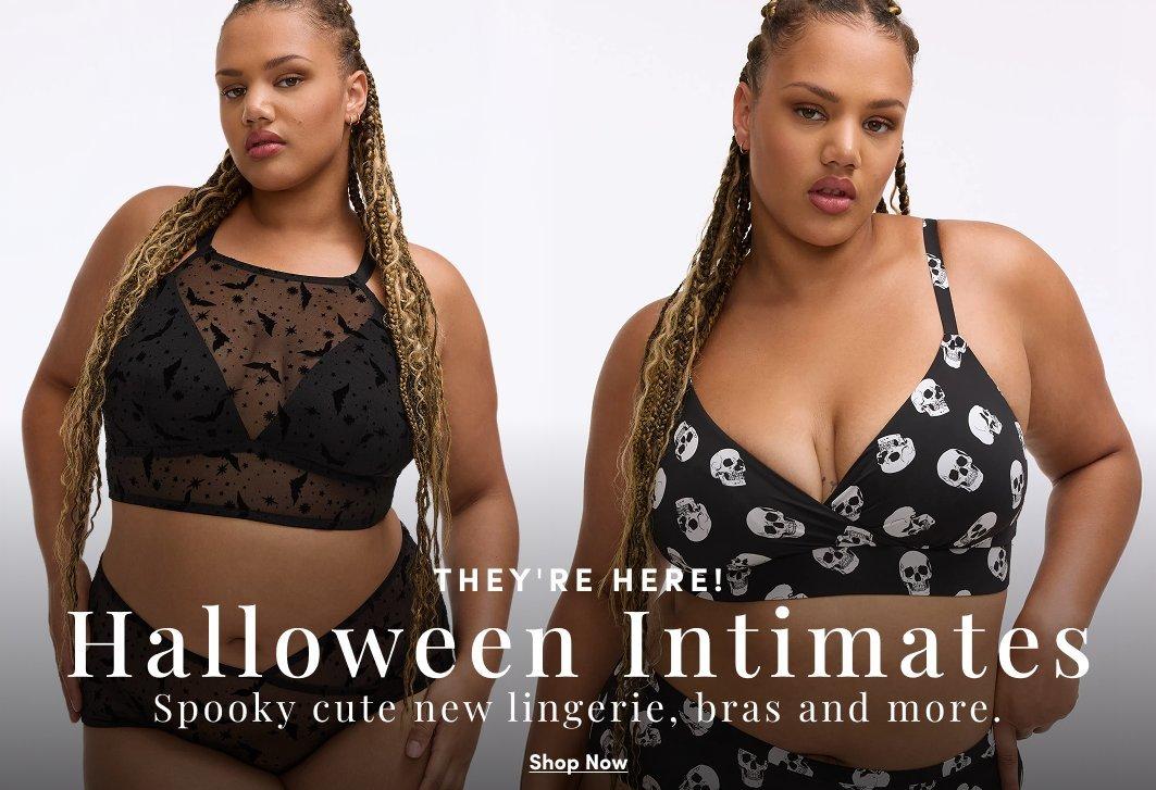 Model wearing a black Halloween-inspired mesh bralette with star and moon details and matching panties against a light neutral background. Text reads, “They’re Here! Halloween Intimates. Spooky cute new lingerie, bras and more.” with a “Shop Now” call to action.