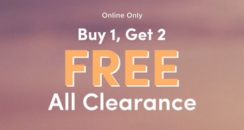 Promotional banner with a soft blurred gradient background transitioning through muted tones of pink, lavender, and peach. Small white text at the top reads 'Online Only.' Below, white bold text reads 'Buy 1, Get 2' followed by large orange bold text reading 'FREE' and white bold text reading 'All Clearance.'