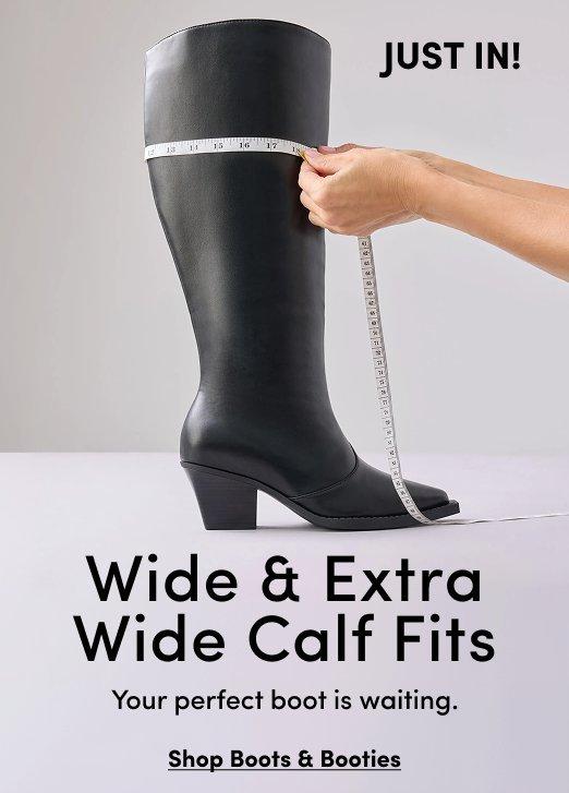 Banner ad for wide and extra wide calf boots. A hand holds a measuring tape around the calf of a tall black leather boot with a block heel and pointed toe. Text reads: Just In! Wide and Extra Wide Calf Fits, Your perfect boot is waiting, Shop Boots and Booties.