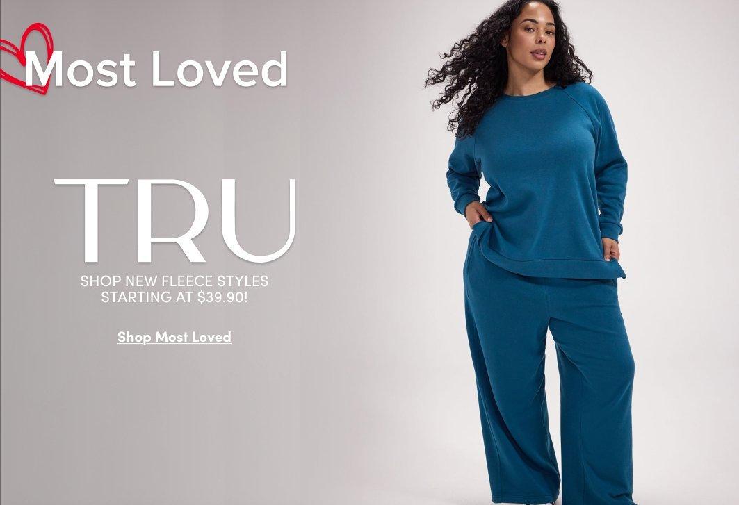 Banner ad for the Seamless Rib collection. A woman with long brown hair stands against a light pink background, wearing a magenta ribbed bralette and matching high-waisted bottoms. Text reads: New Styles, Seamless Rib, Every Fit, Every Hue, So Comfy, Shop Now.