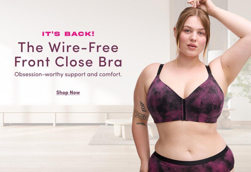 Banner ad for the Wire-Free Front Close Bra. A woman with strawberry blonde hair stands in a bright room, wearing a purple and black galaxy print front-close bra and matching bottoms. Text reads: It's Back! The Wire-Free Front Close Bra, Obsession-worthy support and comfort, Shop Now.