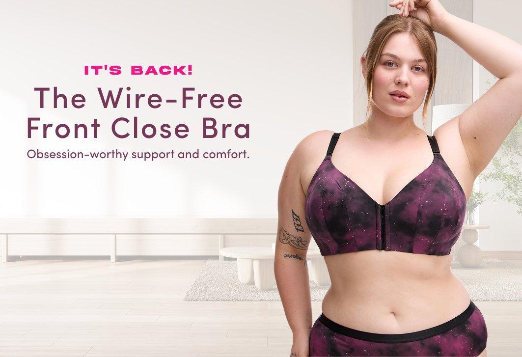 Banner ad for the Wire-Free Front Close Bra. A woman with strawberry blonde hair stands in a bright room, wearing a purple and black galaxy print front-close bra and matching bottoms. Text reads: It's Back! The Wire-Free Front Close Bra, Obsession-worthy support and comfort, Shop Now.