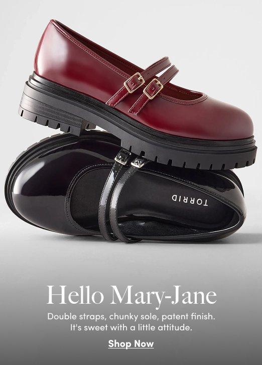 Burgundy and black patent Mary Jane shoes with double straps and chunky lug soles.