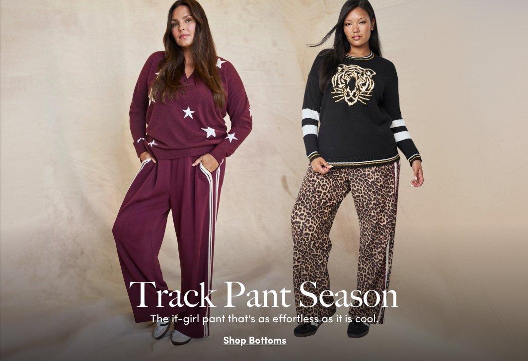 Two models wear burgundy and leopard-print track pants styled with coordinating sweaters.