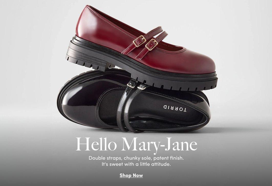 Burgundy and black patent Mary Jane shoes with double straps and chunky lug soles.