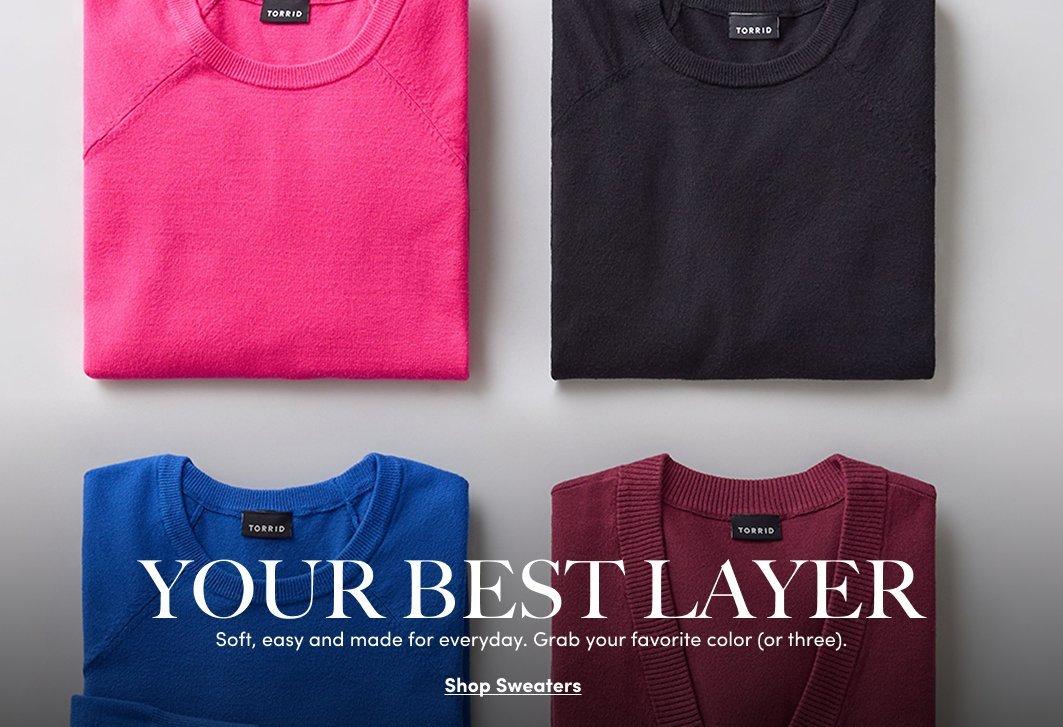 Four folded sweaters in pink, black, blue, and burgundy from the Best Layers collection.