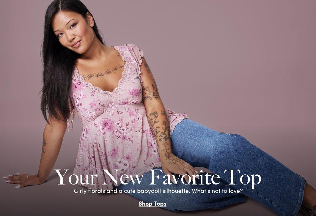 A model wears a pink floral lace-trim babydoll top with blue jeans from the Western Romance collection.