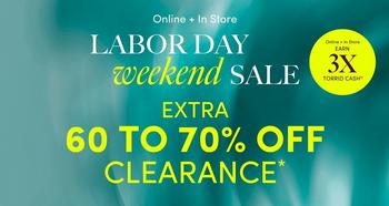 Teal and green gradient background with white and yellow text overlaid. At the top, small white text reads 'Online + In Store'. Below it, large white text reads 'LABOR DAY' followed by italicized cursive text reading 'weekend' and bold white text reading 'SALE'. In the top right corner, small white text reads 'Deluxe & Diehard Earn' above bold yellow text reading '3X' and smaller white text reading 'TORRID CASH'. Below the headline, bold yellow text reads 'EXTRA' followed by large bold white text reading '60 TO 70% OFF' and yellow text reading 'CLEARANCE' with an asterisk. No people or additional graphics appear in the image.