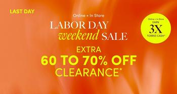 Orange and red gradient background with white and yellow text overlaid. In the top left corner, a black rectangular banner contains white text reading 'LAST DAY'. Below it, small white text reads 'Online + In Store'. Underneath, large white text reads 'LABOR DAY' followed by italicized cursive text reading 'weekend' and bold white text reading 'SALE'. In the top right corner, small white text reads 'Deluxe & Diehard Earn' above bold yellow text reading '3X' and smaller white text reading 'TORRID CASH'. Below the headline, bold yellow text reads 'EXTRA' followed by large bold white text reading '60 TO 70% OFF' and yellow text reading 'CLEARANCE' with an asterisk. No people or additional graphics appear in the image.