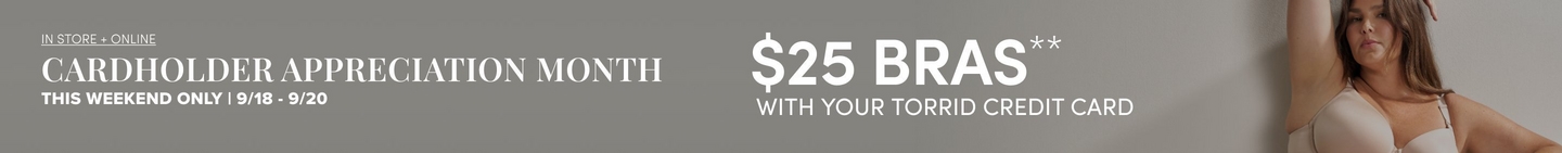 A wide promotional banner on a grey wall background. White text on the left reads, in underlined small capitals, 'IN STORE + ONLINE', then in large serif capitals 'CARDHOLDER APPRECIATION MONTH', then in smaller bold sans-serif 'THIS WEEKEND ONLY | 9/18 - 9/20'. Centered to the right, large bold sans-serif capitals read '$25 BRAS' followed by a double asterisk, with 'WITH YOUR TORRID CREDIT CARD' beneath. At the far right edge a model with long brown hair leans against the wall in a nude molded-cup underwire bra, one arm raised overhead and her hand resting near her head, cropped at mid-torso by the frame.