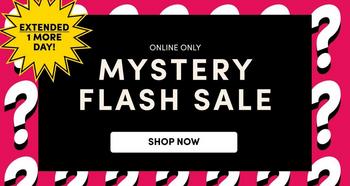A promotional banner on a bright magenta pink background patterned with large white question marks. A black rectangular panel covers the center of the frame. Inside it, small white sans-serif capitals read 'ONLINE ONLY', below that large white serif capitals read 'MYSTERY FLASH SALE' across two lines, and beneath that a white rounded button contains black capitals reading 'SHOP NOW'. At the upper left corner, outside the black panel, a yellow starburst badge holds black capitals reading 'EXTENDED 1 MORE DAY!' across three lines.