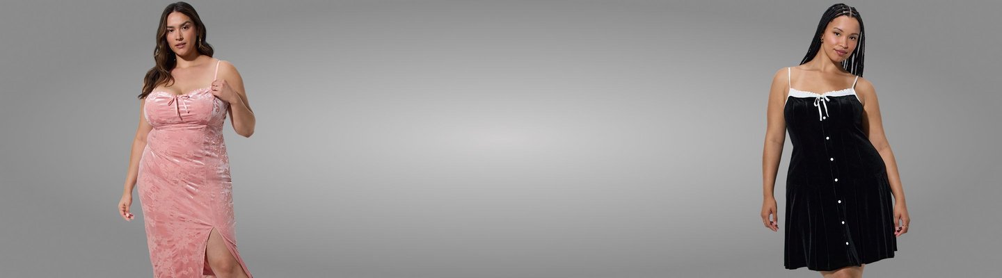 Wide promotional banner against a light grey background. Left model wears a pink crushed velvet slip dress with a bow detail and side slit. Right model has long braided hair wearing a black velvet button-front dress with a white bow at the neckline.