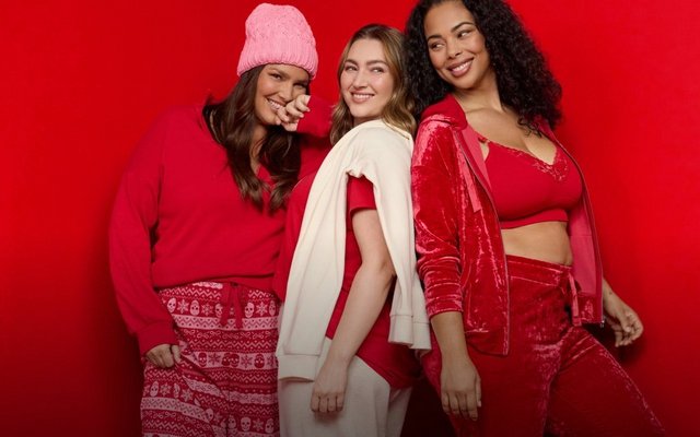 Three models wear cozy red and cream holiday styles against a red background.