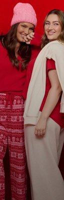 Models wearing cozy holiday outfits.