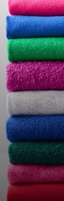 Stack of colorful folded sweaters.