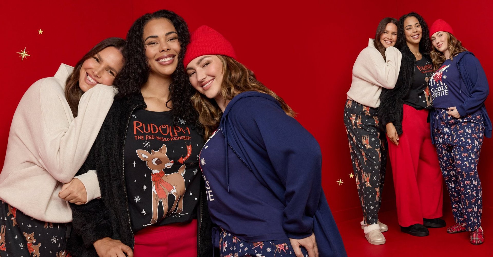 Three women model festive graphic tops, cozy fleece, and holiday-print pants against a red background.