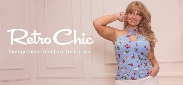 'A wide promotional banner with a soft blush pink paneled wall background featuring a plus-size model standing with one hand raised near her ear and the other in her pocket, smiling and looking to the side. She wears a light blue fruit and floral print cross-neck halter top with a keyhole cutout and white pants, and has voluminous wavy blonde hair with bangs. Overlaid on the left in large white script text reads Retro Chic, with smaller white text below reading Vintage Vibes That Love Up Curves.'