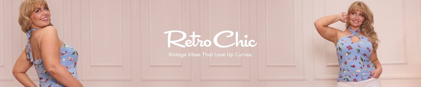 'A wide promotional banner with a soft blush pink paneled wall background featuring the same plus-size model shown from two angles. On the left the model is shown from behind looking over her shoulder and smiling, displaying the open back and tie detail of a light blue halter top printed with a fruit and floral pattern. On the right the model faces forward with one hand raised near her ear, smiling, wearing the same light blue fruit and floral print cross-neck halter top with a keyhole cutout and white pants. She has voluminous wavy blonde hair with bangs. In the center in large white script text reads Retro Chic, with smaller white text below reading Vintage Vibes That Love Up Curves.'